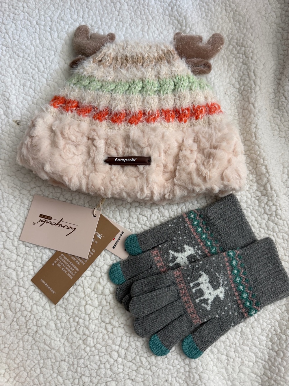 Kangol women Plush Reindeer Beanie in Cream with Orange & Green Accents